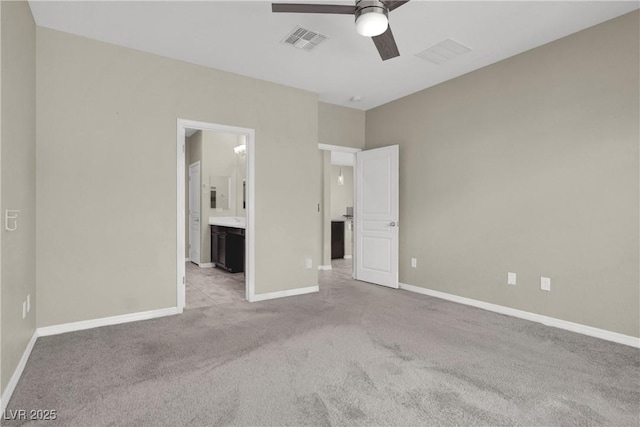 10976 Bluebell Basin Rd, Las Vegas, NV 89179 - unfurnished bedroom with carpet flooring, baseboards, ensuite bath, and ceiling fan