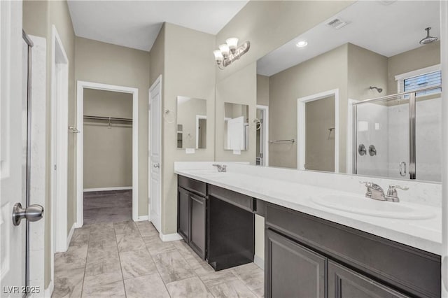 10976 Bluebell Basin Rd, Las Vegas, NV 89179 - full bathroom with a shower stall, a spacious closet, double vanity, marble finish floors, and baseboards