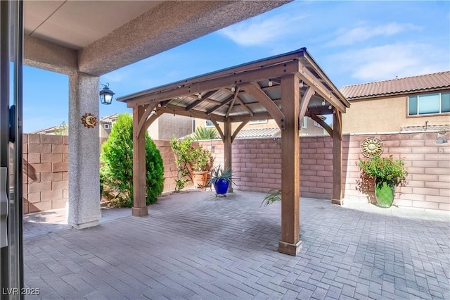 10976 Bluebell Basin Rd, Las Vegas, NV 89179 - fenced backyard featuring a gazebo and a patio