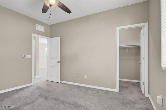 10976 Bluebell Basin Rd, Las Vegas, NV 89179 - unfurnished bedroom featuring carpet flooring, a spacious closet, and baseboards