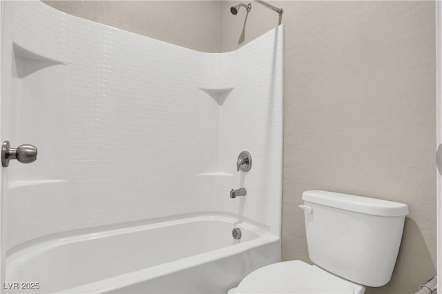 10976 Bluebell Basin Rd, Las Vegas, NV 89179 - full bath featuring toilet,  shower combination, and a textured wall
