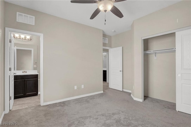 10976 Bluebell Basin Rd, Las Vegas, NV 89179 - unfurnished bedroom featuring light colored carpet, a closet, and baseboards
