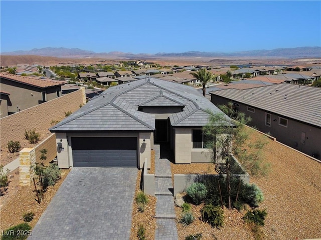 54 Mirage View Dr, Henderson, NV 89011 - ranch-style home with a garage, a residential view, a mountain view, and decorative driveway