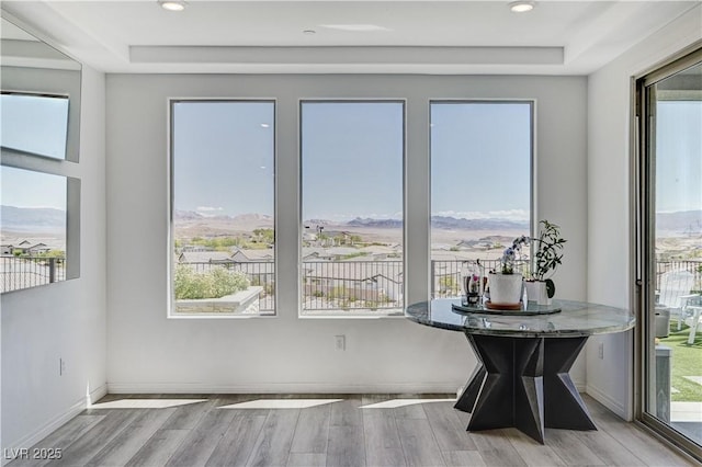 54 Mirage View Dr, Henderson, NV 89011 - dining space with a raised ceiling, wood finished floors, plenty of natural light, and recessed lighting