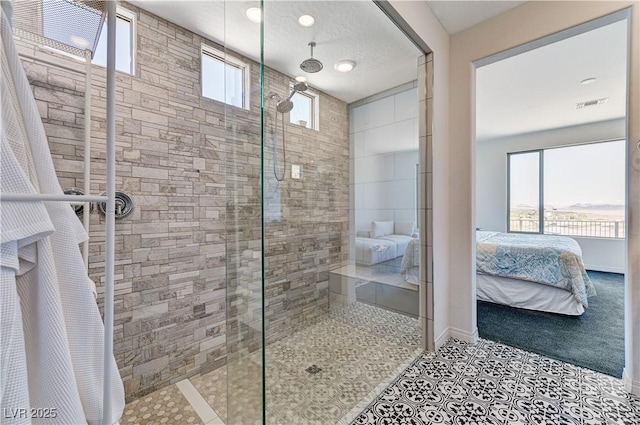 54 Mirage View Dr, Henderson, NV 89011 - bathroom with connected bathroom, a tile shower, and baseboards
