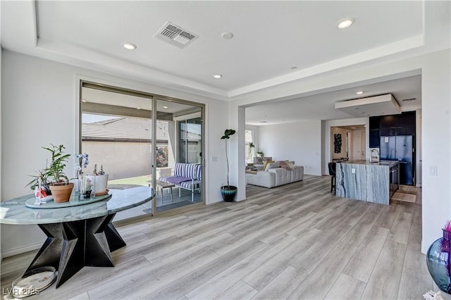 54 Mirage View Dr, Henderson, NV 89011 - living room with a tray ceiling, light wood finished floors, and recessed lighting