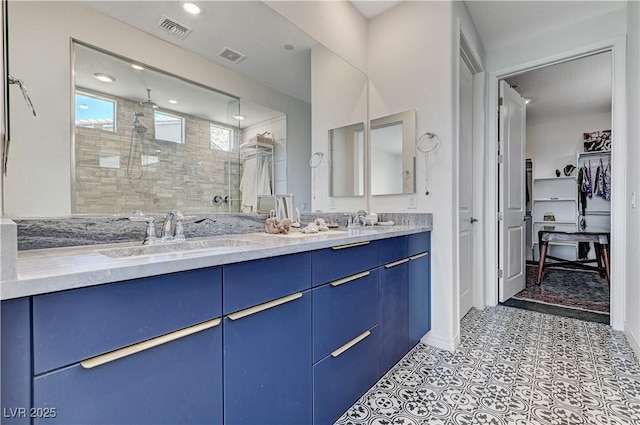 54 Mirage View Dr, Henderson, NV 89011 - full bath featuring a stall shower, double vanity, and a walk in closet