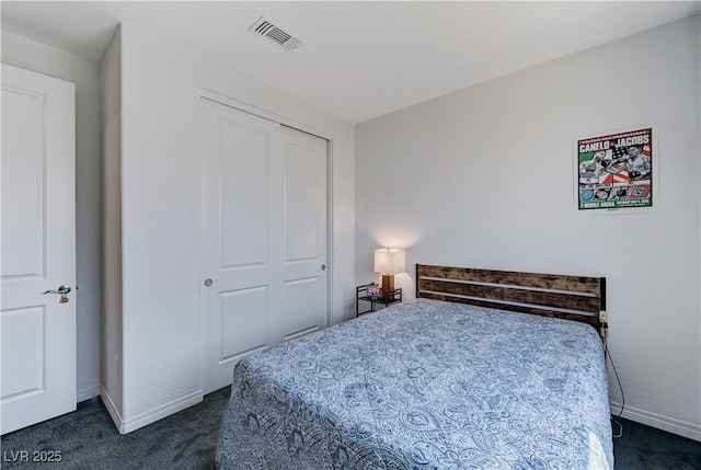54 Mirage View Dr, Henderson, NV 89011 - bedroom featuring dark colored carpet, a closet, and baseboards