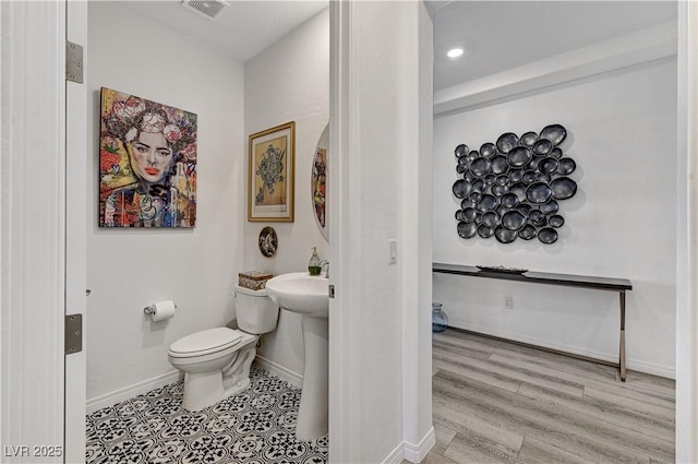 54 Mirage View Dr, Henderson, NV 89011 - half bathroom with toilet, baseboards, and recessed lighting