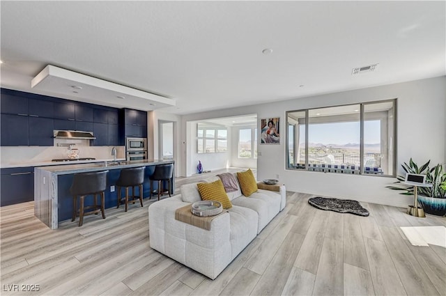54 Mirage View Dr, Henderson, NV 89011 - living room with light wood finished floors