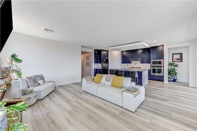 54 Mirage View Dr, Henderson, NV 89011 - living room featuring light wood finished floors, recessed lighting, and baseboards