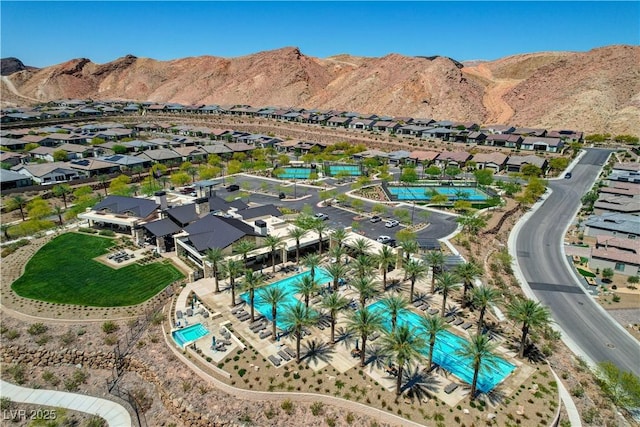 54 Mirage View Dr, Henderson, NV 89011 - aerial perspective of suburban area with a pool and a mountain backdrop