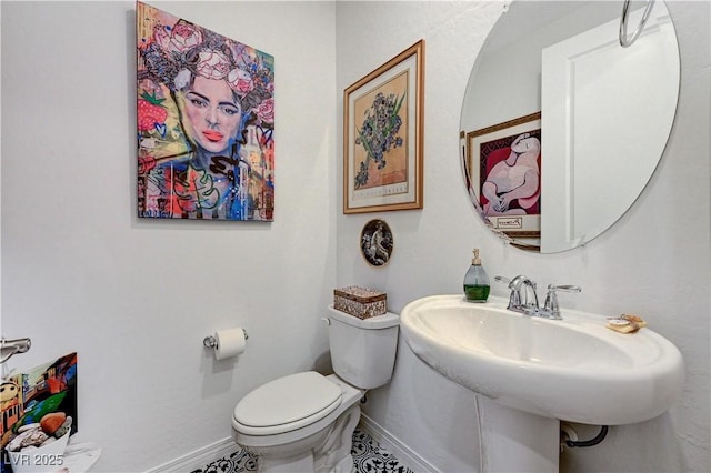 54 Mirage View Dr, Henderson, NV 89011 - bathroom featuring toilet, baseboards, and a sink