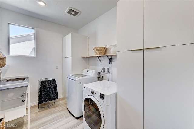 54 Mirage View Dr, Henderson, NV 89011 - clothes washing area with washing machine and dryer, light wood finished floors, and baseboards
