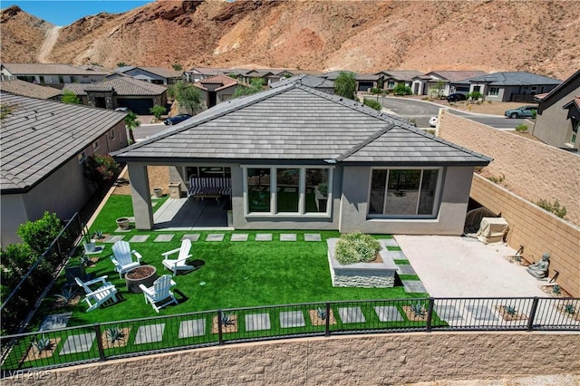 54 Mirage View Dr, Henderson, NV 89011 - rear view of house featuring a patio area, a residential view, stucco siding, and an outdoor fire pit