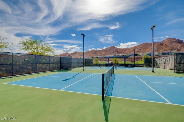 54 Mirage View Dr, Henderson, NV 89011 - view of tennis court featuring community basketball court, a mountain view, and fence