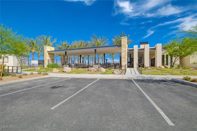 54 Mirage View Dr, Henderson, NV 89011 - view of building exterior featuring uncovered parking and fence
