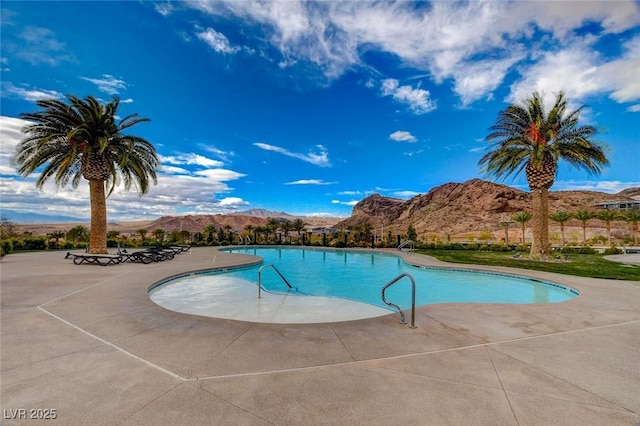 54 Mirage View Dr, Henderson, NV 89011 - community pool with a mountain view and a patio