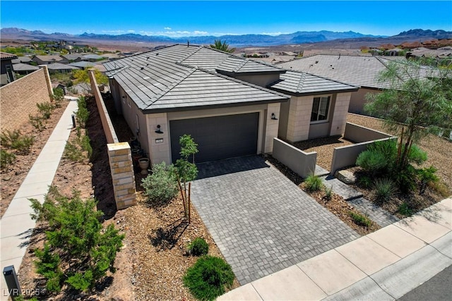 54 Mirage View Dr, Henderson, NV 89011 - ranch-style house featuring a garage, fence, decorative driveway, and a mountain view