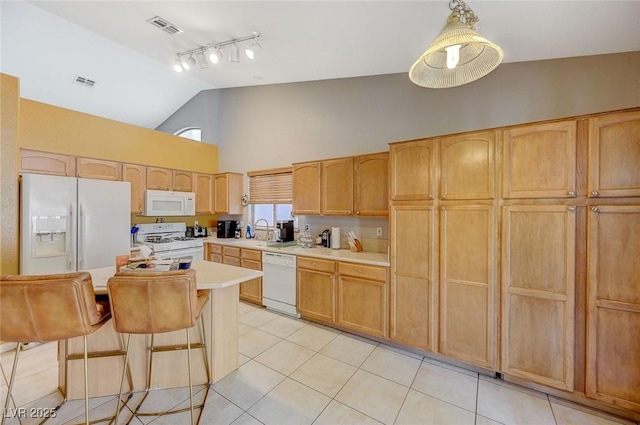 kitchen featuring rail lighting, visible vents, white appliances, light tile patterned flooring, and high vaulted ceiling