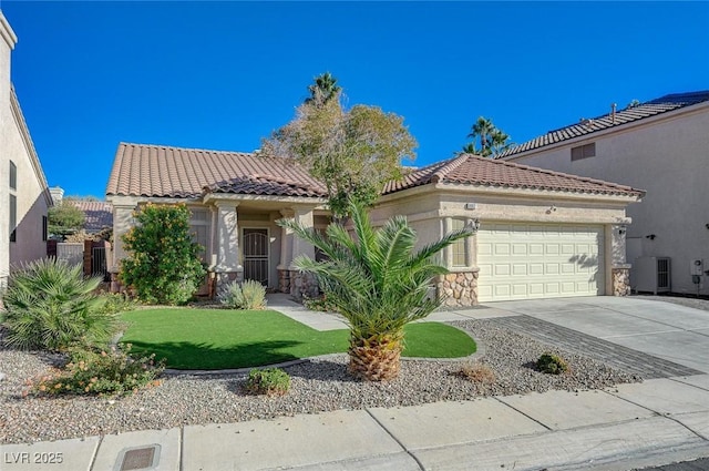 mediterranean / spanish-style home featuring an attached garage, a tiled roof, driveway, and stucco siding