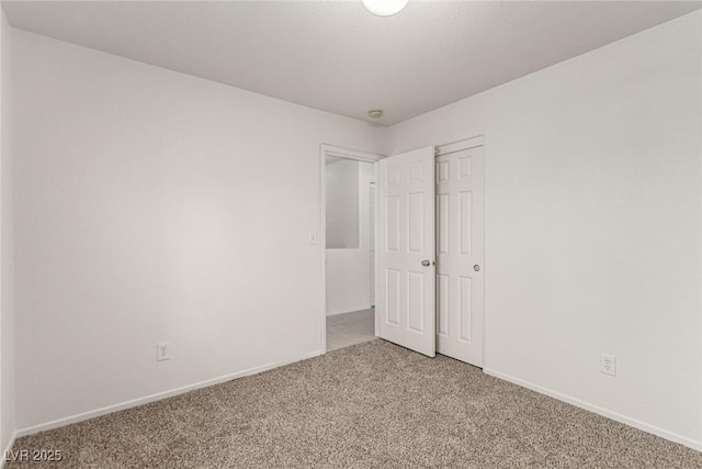 519 Brinkburn Point Ave, Las Vegas, NV 89178 - unfurnished bedroom featuring baseboards, a closet, and light colored carpet
