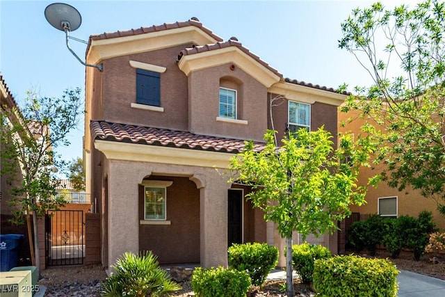 519 Brinkburn Point Ave, Las Vegas, NV 89178 - mediterranean / spanish-style home featuring a gate, a tiled roof, and stucco siding