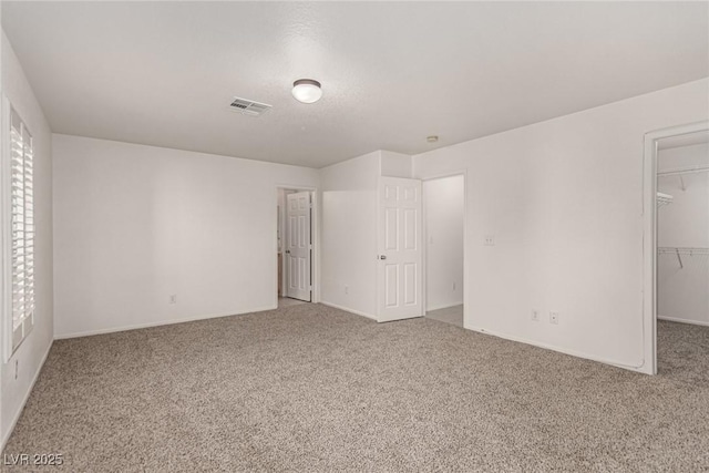 519 Brinkburn Point Ave, Las Vegas, NV 89178 - unfurnished bedroom featuring visible vents, carpet, and a spacious closet