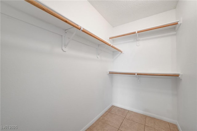 2377 Los Feliz St, Las Vegas, NV 89156 - spacious closet with light tile patterned floors