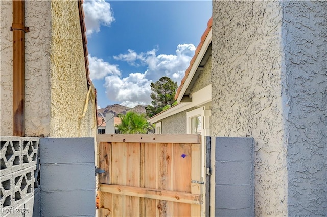 2377 Los Feliz St, Las Vegas, NV 89156 - view of home's exterior featuring stucco siding and a gate