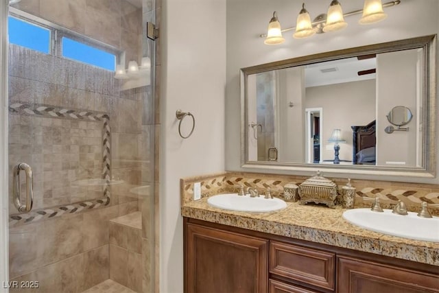 bathroom with a sink, connected bathroom, and a stall shower