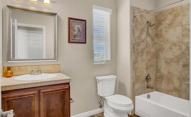 full bathroom featuring bathtub / shower combination, baseboards, vanity, and toilet