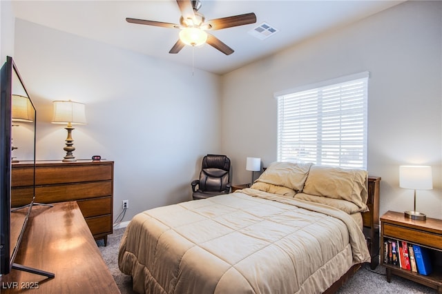 carpeted bedroom with ceiling fan and visible vents