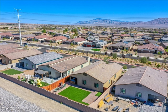 birds eye view of property featuring a mountain view and a residential view