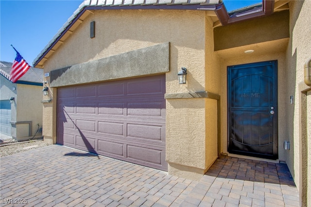 garage featuring driveway