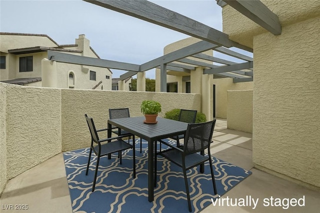 view of patio / terrace with outdoor dining area and fence