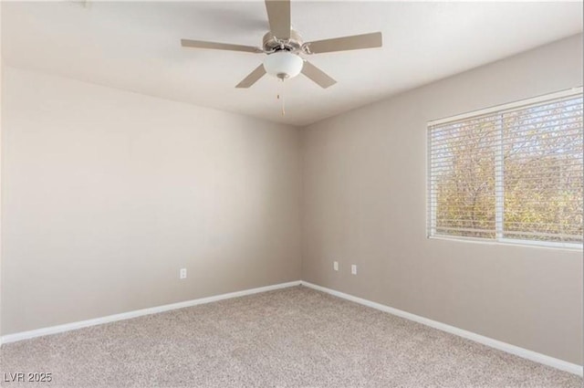 empty room with baseboards, a ceiling fan, and carpet flooring