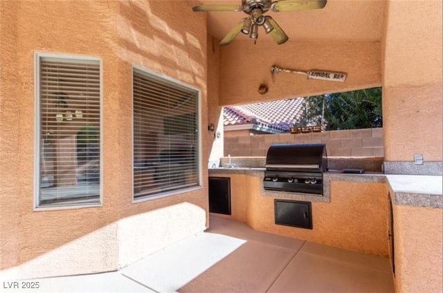 view of patio featuring a ceiling fan, a sink, area for grilling, and fence