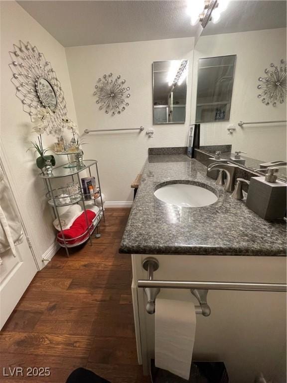 682 Oakmont Ave Unit 1507, Las Vegas, NV 89109 - bathroom with vanity and wood finished floors