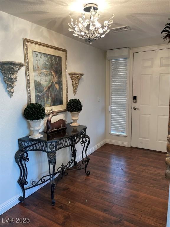 682 Oakmont Ave Unit 1507, Las Vegas, NV 89109 - entryway with a chandelier and wood finished floors