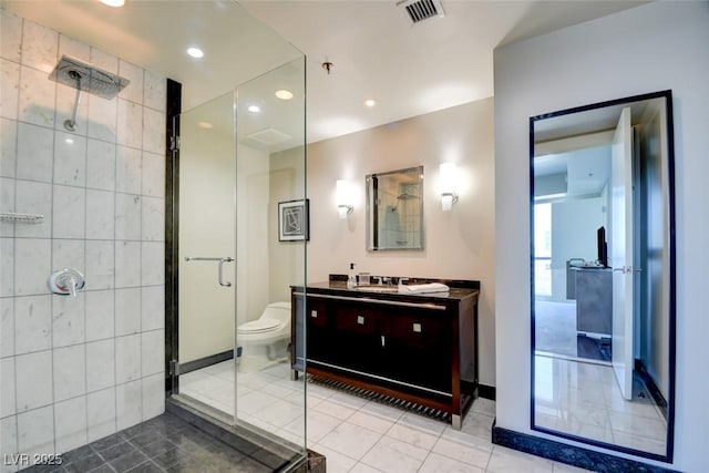 bathroom featuring vanity, toilet, recessed lighting, a shower stall, and visible vents