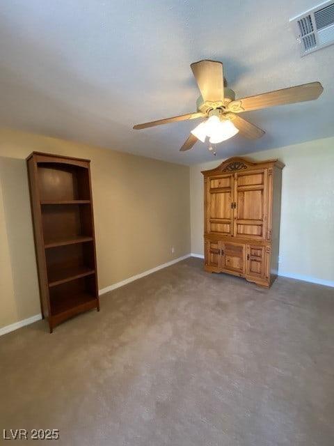 unfurnished bedroom with light carpet, baseboards, visible vents, and a ceiling fan