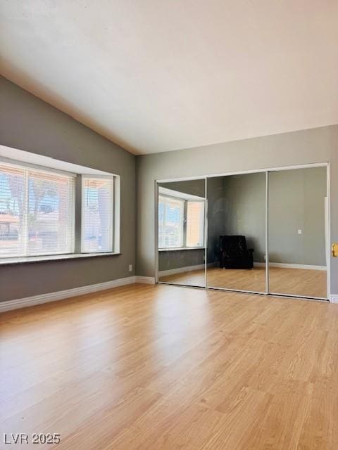 6786 Grandola Dr, Las Vegas, NV 89103 - unfurnished bedroom with baseboards, light wood-style floors, and a closet