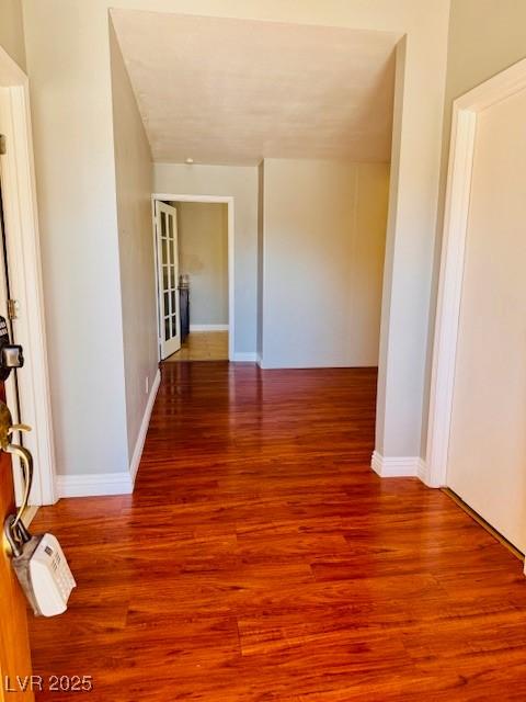 6786 Grandola Dr, Las Vegas, NV 89103 - hall with wood finished floors and baseboards