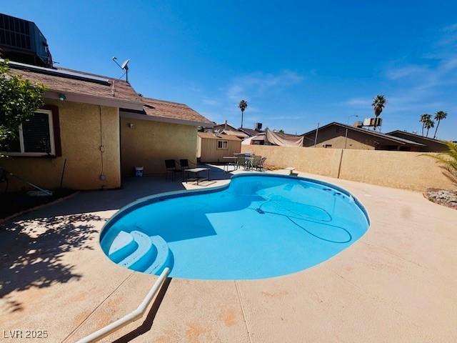 6786 Grandola Dr, Las Vegas, NV 89103 - view of pool featuring a patio area, a fenced in pool, central AC, and a fenced backyard