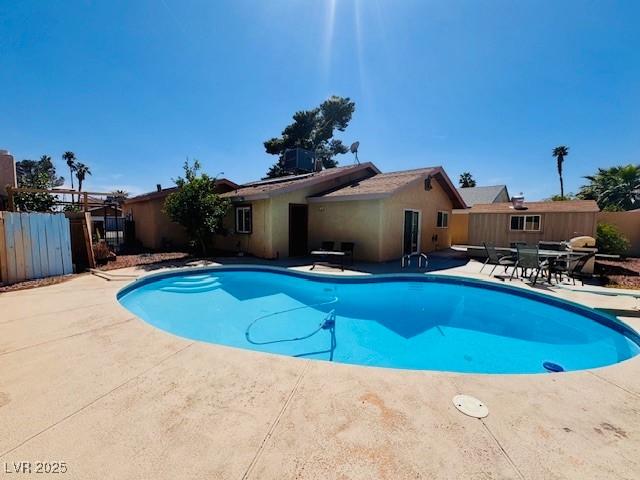 6786 Grandola Dr, Las Vegas, NV 89103 - view of pool featuring a diving board, fence, a patio, and a fenced in pool