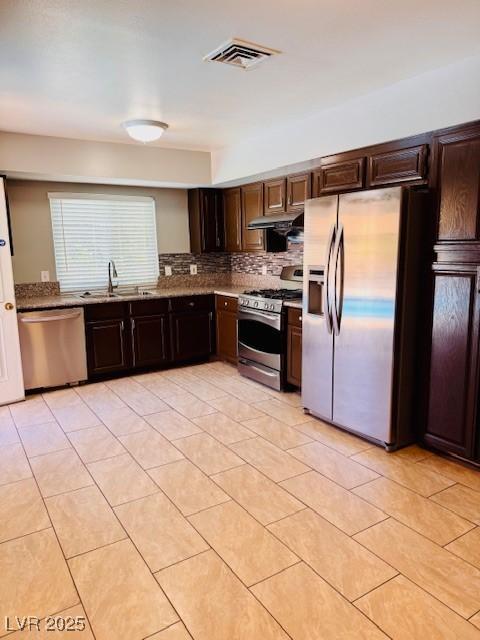6786 Grandola Dr, Las Vegas, NV 89103 - kitchen with visible vents, dark brown cabinetry, stainless steel appliances, and a sink