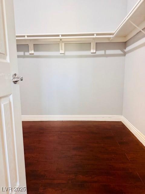 6786 Grandola Dr, Las Vegas, NV 89103 - spacious closet featuring wood finished floors