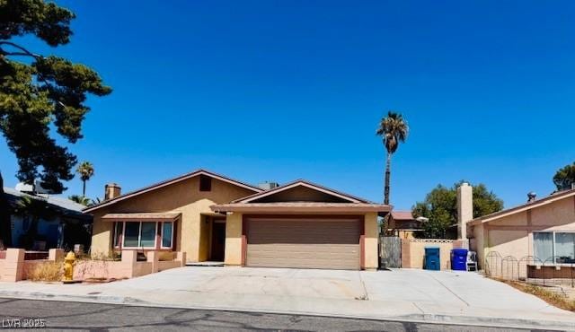 6786 Grandola Dr, Las Vegas, NV 89103 - ranch-style home featuring stucco siding, driveway, fence, and a garage