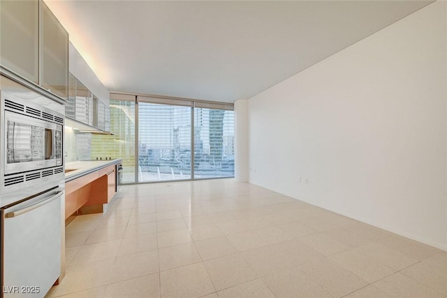 3726 S Las Vegas Blvd Unit 1003, Las Vegas, NV 89158 - kitchen with stainless steel microwave, light countertops, dishwasher, and modern cabinets